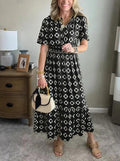 Vestido largo elegante y moderno con escote en V, cintura elástica y estampado de lunares.