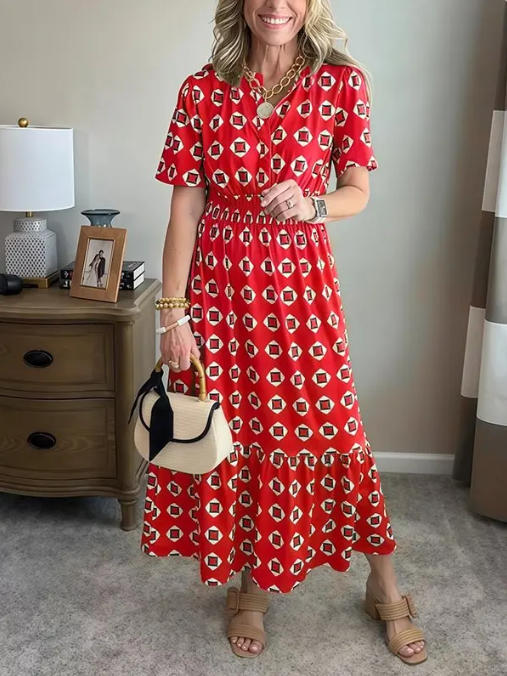 Vestido largo elegante y moderno con escote en V, cintura elástica y estampado de lunares.