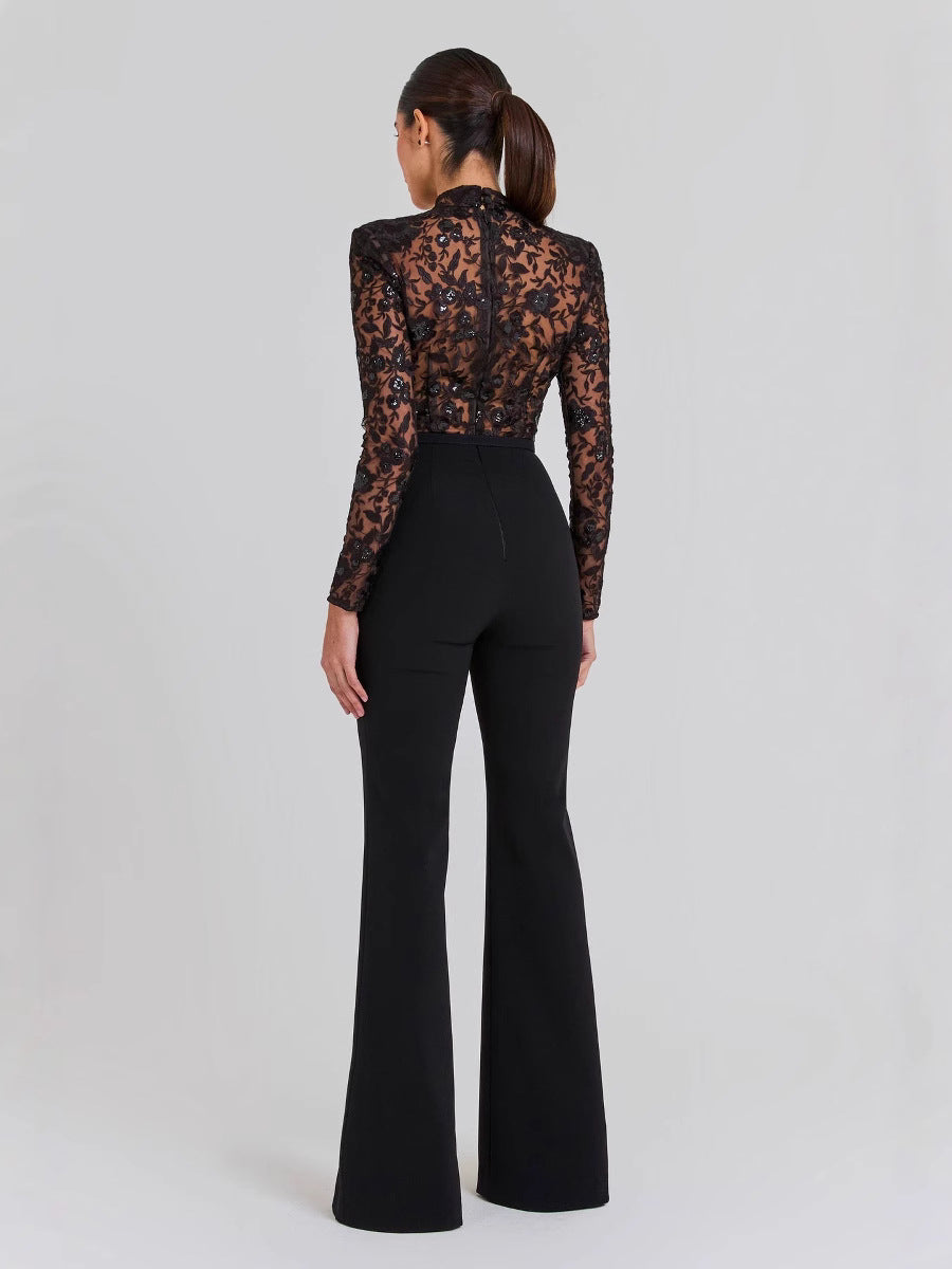 Mono negro transparente de encaje con mangas largas y pantalón.