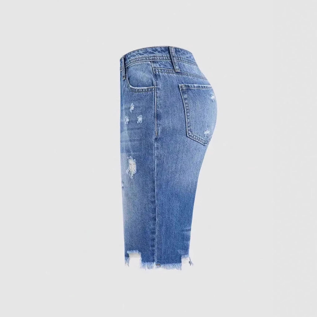 Pantalones cortos vaqueros rotos de largo medio — estilo casual