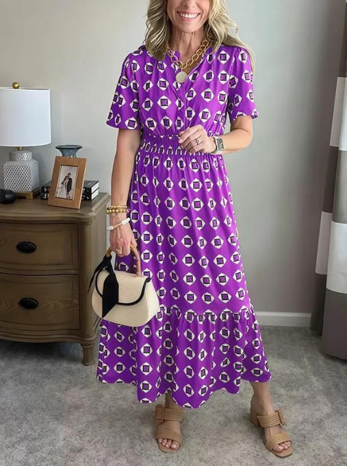 Vestido largo elegante y moderno con escote en V, cintura elástica y estampado de lunares.