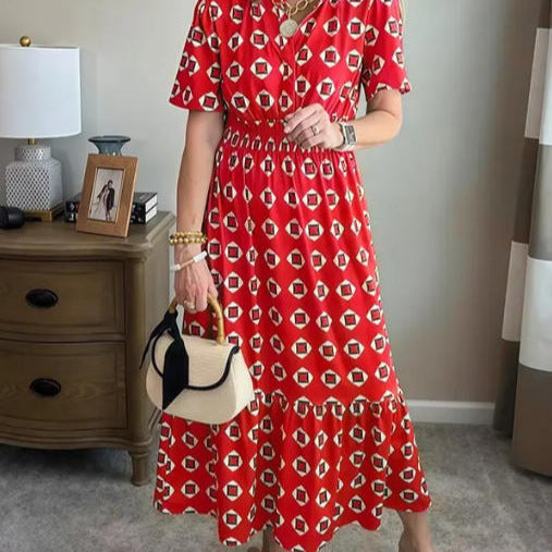 Vestido largo elegante y moderno con escote en V, cintura elástica y estampado de lunares.