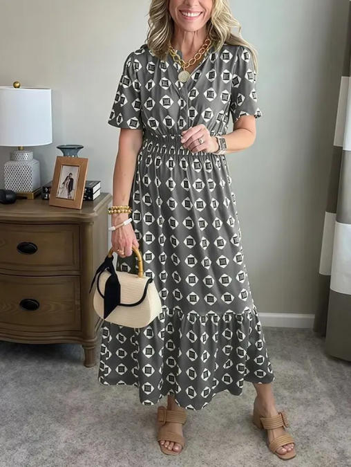 Vestido largo elegante y moderno con escote en V, cintura elástica y estampado de lunares.