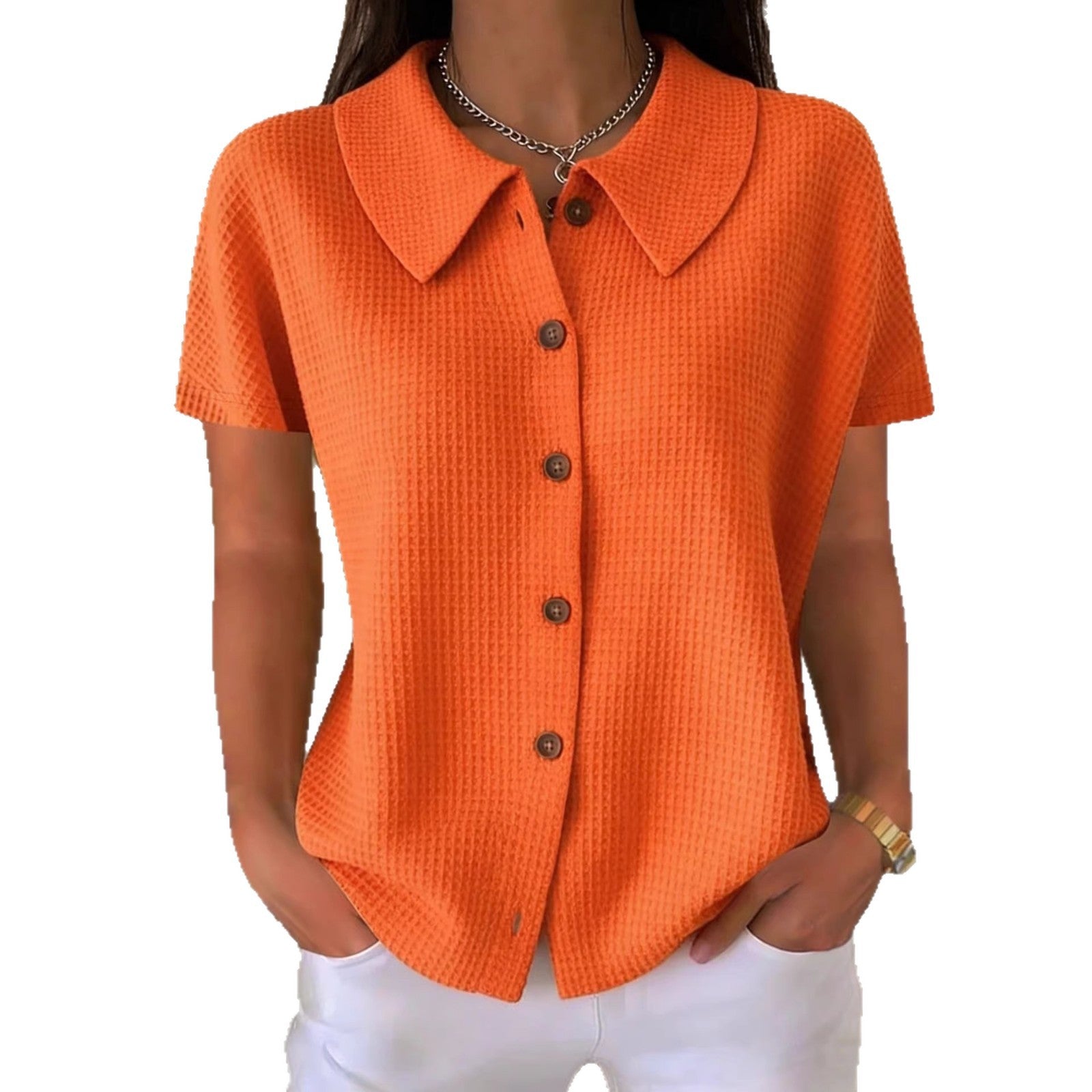 Camisa informal de manga corta, color liso, corte holgado, con cuello vuelto y tejido gofrado.