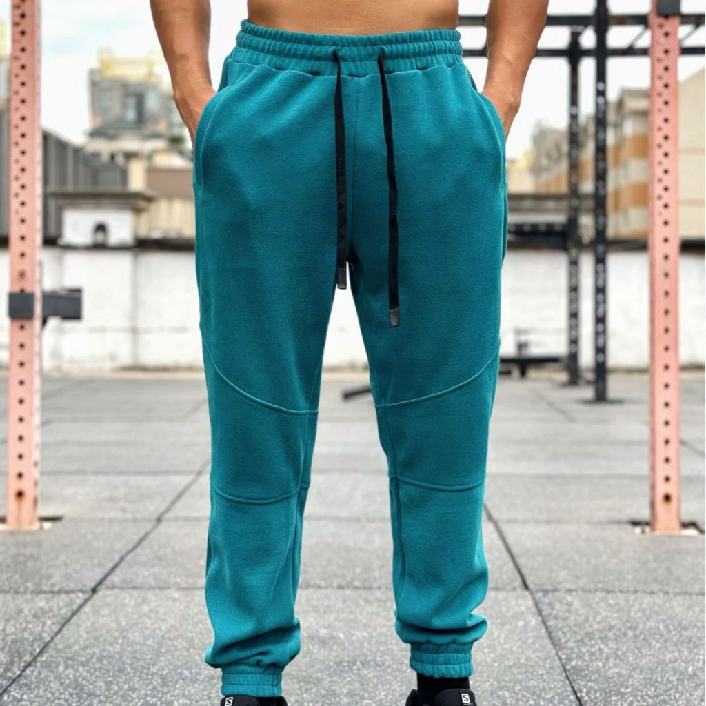 Pantalones deportivos americanos para hombre con puños y cordón ajustable.