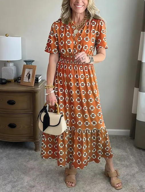 Vestido largo elegante y moderno con escote en V, cintura elástica y estampado de lunares.