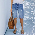 Pantalones cortos vaqueros rotos de largo medio — estilo casual