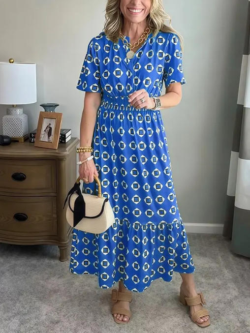 Vestido largo elegante y moderno con escote en V, cintura elástica y estampado de lunares.