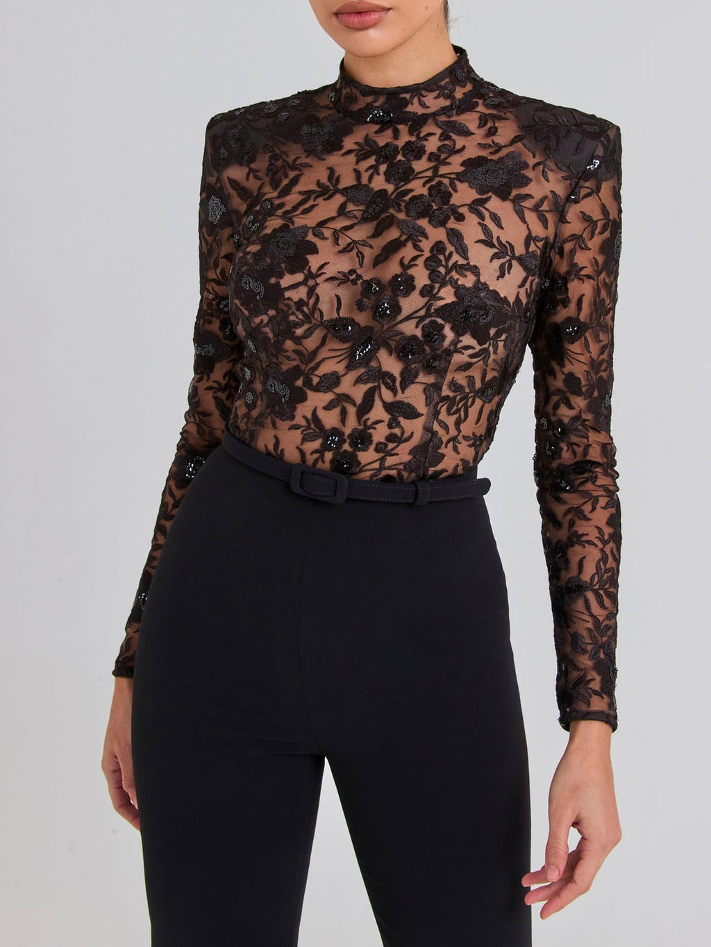 Sheer black lace long-sleeve jumpsuit.
