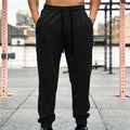 Pantalones deportivos americanos para hombre con puños y cordón ajustable.