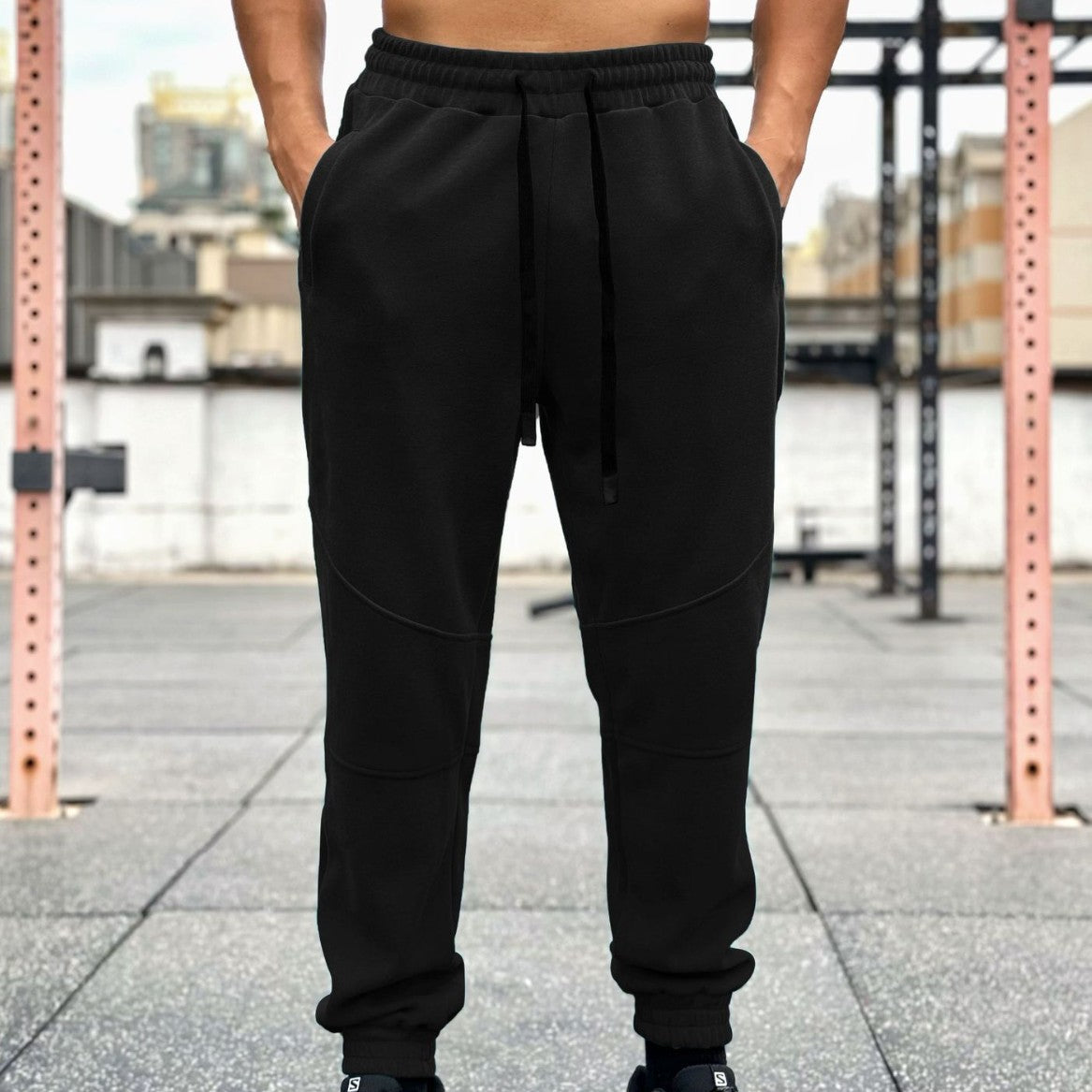 Pantalones deportivos americanos para hombre con puños y cordón ajustable.