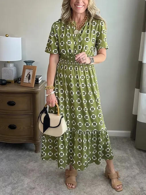 Vestido largo elegante y moderno con escote en V, cintura elástica y estampado de lunares.