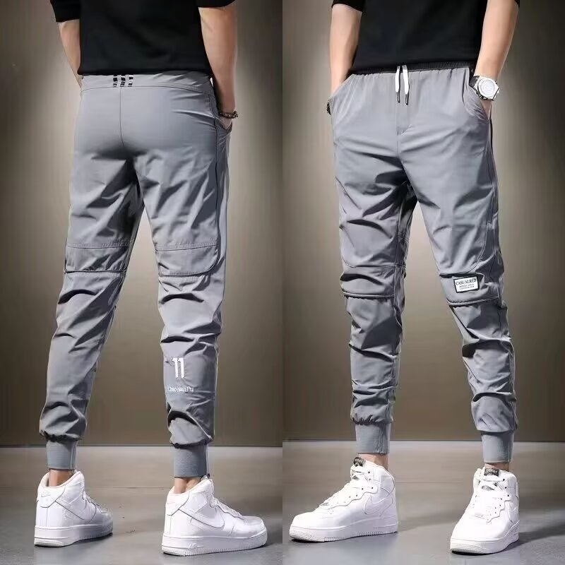 Pantalones deportivos de secado rápido para hombre, corte ajustado, elásticos y versátiles, con cordones en los tobillos, ideales para otoño.