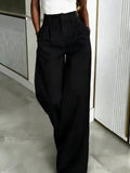 Pantalones casuales holgados y fluidos que favorecen la figura hasta el suelo.
