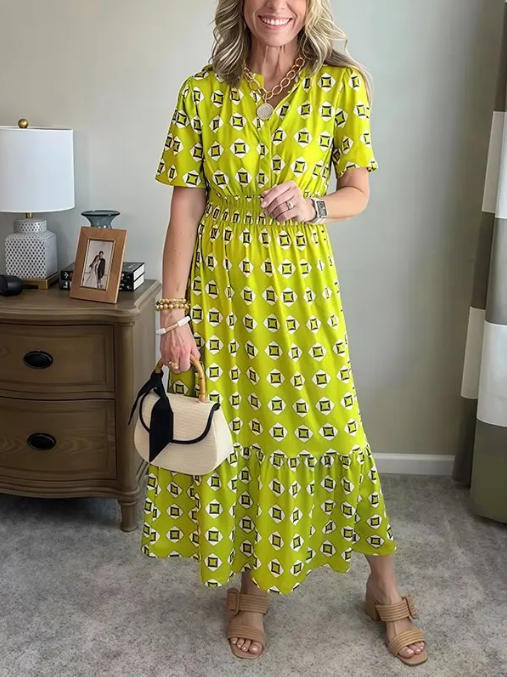 Vestido largo elegante y moderno con escote en V, cintura elástica y estampado de lunares.