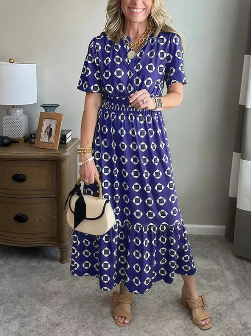 Vestido largo elegante y moderno con escote en V, cintura elástica y estampado de lunares.