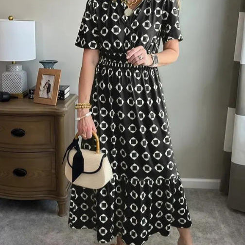 Vestido largo elegante y moderno con escote en V, cintura elástica y estampado de lunares.