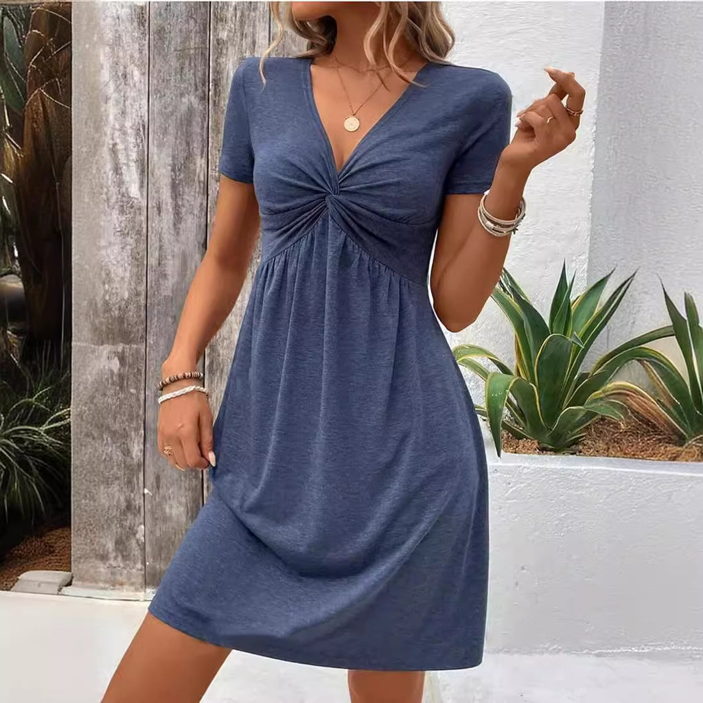 Vestido de algodón de manga corta con cuello en V y diseño de nudo en el pecho.